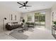 Spacious living room with sliding glass doors to patio at 13456 Via Varra # 118, Broomfield, CO 80020