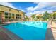 Relaxing pool area with lounge chairs and grill at 13456 Via Varra # 118, Broomfield, CO 80020