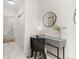 Stylish vanity area with a large mirror and wicker chair at 13456 Via Varra # 118, Broomfield, CO 80020
