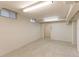 Unfinished basement with updated paint and carpet at 353 S Niagara St, Denver, CO 80224