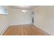 Dining room features hardwood floors, neutral paint, and an elegant chandelier at 353 S Niagara St, Denver, CO 80224