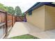 Side view of house showing fenced yard and gate at 353 S Niagara St, Denver, CO 80224