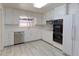 Bright kitchen with white cabinets, ample counter space, and stainless steel appliances at 353 S Niagara St, Denver, CO 80224