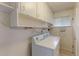 Functional laundry room with washer, dryer, and ample storage space at 353 S Niagara St, Denver, CO 80224