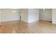 Bright living room featuring hardwood floors, white trim, and an elegant chandelier at 353 S Niagara St, Denver, CO 80224