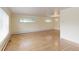 Spacious living room with hardwood floors, neutral paint, and an elegant chandelier at 353 S Niagara St, Denver, CO 80224