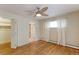 Spacious bedroom featuring a ceiling fan, closet, and natural light at 353 S Niagara St, Denver, CO 80224