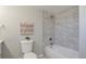 Updated bathroom with a bathtub and tiled shower at 1765 Ingalls St, Lakewood, CO 80214