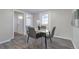 Modern dining area with a sleek marble-top table and four gray chairs at 1765 Ingalls St, Lakewood, CO 80214
