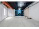 Unfinished basement featuring concrete floors, exposed beams, framed walls, and bright lighting at 1848 W 68Th Ave, Denver, CO 80221