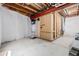 Unfinished basement featuring concrete floors, exposed beams, framed walls, and bright lighting at 1848 W 68Th Ave, Denver, CO 80221