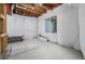Unfinished basement featuring concrete floors, exposed beams, framed walls, and bright lighting at 1848 W 68Th Ave, Denver, CO 80221