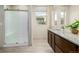 Stylish bathroom features a granite sink, modern fixtures, and glass enclosed shower at 1848 W 68Th Ave, Denver, CO 80221