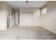 Comfortable carpeted bedroom with closet, neutral walls, and bright lighting at 1848 W 68Th Ave, Denver, CO 80221