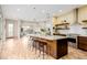 Modern kitchen with granite countertops, stainless steel appliances, and open shelving at 1848 W 68Th Ave, Denver, CO 80221