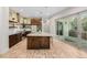 Beautiful kitchen with island, granite countertops, and stainless steel appliances at 1848 W 68Th Ave, Denver, CO 80221