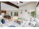 Bright open-concept living space with modern furnishings and light hardwood floors at 1848 W 68Th Ave, Denver, CO 80221