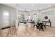 Spacious living room with tall ceilings, modern decor, large windows, and wood flooring at 1848 W 68Th Ave, Denver, CO 80221