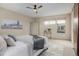 This bedroom features neutral paint, plush carpet, ceiling fan and large windows with natural light at 1848 W 68Th Ave, Denver, CO 80221