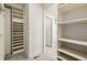 This walk-in closet features custom shelving and plenty of room for storage at 1848 W 68Th Ave, Denver, CO 80221