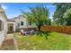 Large backyard with fire pit and wooden fence at 1111 E Dartmouth Ave, Englewood, CO 80113