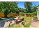Backyard patio with seating area and hot tub at 1111 E Dartmouth Ave, Englewood, CO 80113
