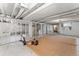 Large unfinished basement with exposed ceiling, offering a blank canvas for storage or future renovations and customization at 1111 E Dartmouth Ave, Englewood, CO 80113