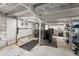 Spacious unfinished basement featuring exposed beams and concrete floors, offering ample storage and customization potential at 1111 E Dartmouth Ave, Englewood, CO 80113