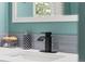 Close-up of bathroom sink with modern black faucet at 1111 E Dartmouth Ave, Englewood, CO 80113