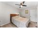 Bright bedroom with ceiling fan and wooden bed frame at 1111 E Dartmouth Ave, Englewood, CO 80113