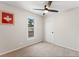 Spacious bedroom with ceiling fan and carpet flooring at 1111 E Dartmouth Ave, Englewood, CO 80113