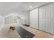 Large bonus room with closet space and yoga mats at 1111 E Dartmouth Ave, Englewood, CO 80113