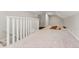 Bonus room with carpet flooring and white railing at 1111 E Dartmouth Ave, Englewood, CO 80113