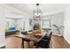 Modern dining room with a long live-edge wood table at 1111 E Dartmouth Ave, Englewood, CO 80113