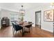 Bright dining room with hardwood floors and a large table at 1111 E Dartmouth Ave, Englewood, CO 80113