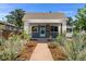 Charming bungalow with landscaped front yard and walkway at 1111 E Dartmouth Ave, Englewood, CO 80113