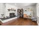 Stone fireplace with wood mantel in living room at 1111 E Dartmouth Ave, Englewood, CO 80113
