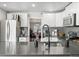 Modern kitchen with stainless steel appliances and a large island at 1111 E Dartmouth Ave, Englewood, CO 80113