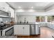 Modern kitchen with stainless steel appliances and gray countertops at 1111 E Dartmouth Ave, Englewood, CO 80113