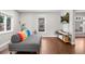 Living room with hardwood floors and comfortable seating at 1111 E Dartmouth Ave, Englewood, CO 80113