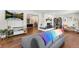 Living room with stone fireplace and hardwood floors at 1111 E Dartmouth Ave, Englewood, CO 80113