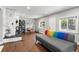 Living area featuring hardwood floors and stone fireplace at 1111 E Dartmouth Ave, Englewood, CO 80113