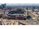 This aerial view shows Coors Field and the city of Denver in the background at 2245 Blake St # L M N, Denver, CO 80205
