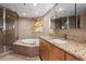 Elegant bathroom with soaking tub, shower, and double vanity at 2245 Blake St # L M N, Denver, CO 80205