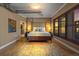 Primary bedroom with hardwood floors and large bed at 2245 Blake St # L M N, Denver, CO 80205