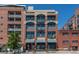 Street view of condo building, brick and windows at 2245 Blake St # L M N, Denver, CO 80205
