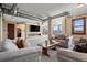 Expansive living room with fireplace, ample seating, and city views at 2245 Blake St # L M N, Denver, CO 80205