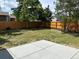 Large backyard featuring a wooden fence and a well-maintained lawn at 10431 Holland St, Broomfield, CO 80021
