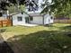 Spacious backyard with a well-kept lawn and a concrete patio area at 10431 Holland St, Broomfield, CO 80021