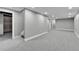 Finished basement featuring ample space with recessed lighting and neutral paint and carpet at 10431 Holland St, Broomfield, CO 80021